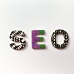 strangely colored letters spell out seo