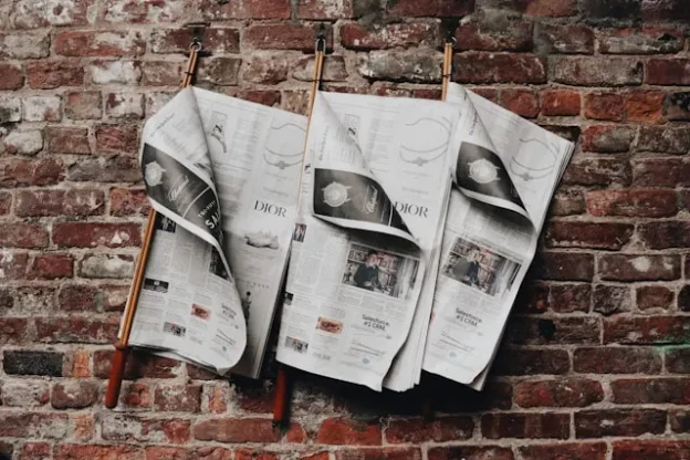 Newspaper hanged over wall