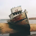 Abandoned ship at shore